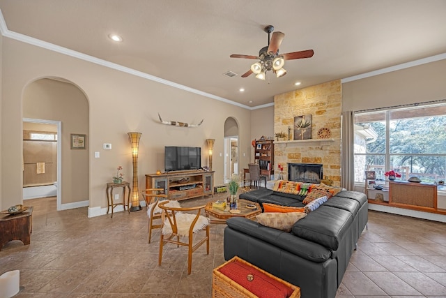 615 Mountain Crest Dr, Wimberley, TX 78676 - living area with arched walkways, ornamental molding, ceiling fan, baseboards, and recessed lighting