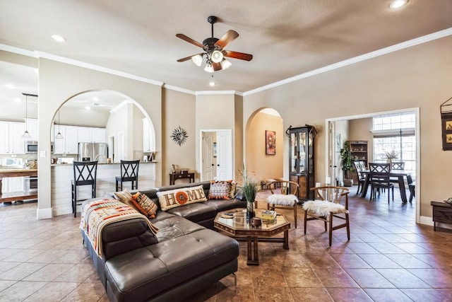 615 Mountain Crest Dr, Wimberley, TX 78676 - living area featuring arched walkways, ceiling fan, crown molding, recessed lighting, and tile patterned flooring