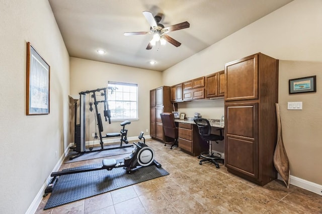 615 Mountain Crest Dr, Wimberley, TX 78676 - exercise area featuring ceiling fan, baseboards, light tile patterned flooring, and built in desk