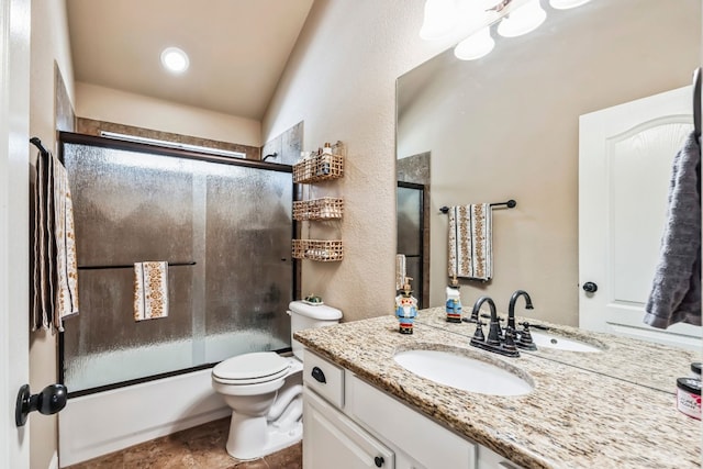 615 Mountain Crest Dr, Wimberley, TX 78676 - full bath featuring vanity, toilet, bath / shower combo with glass door, and a textured wall