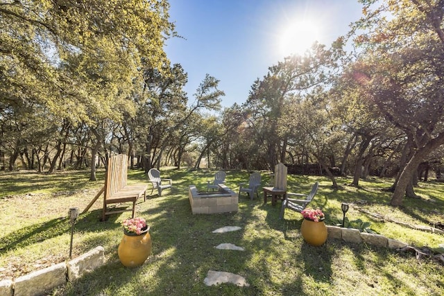 615 Mountain Crest Dr, Wimberley, TX 78676 - view of green lawn featuring view of scattered trees and a fire pit