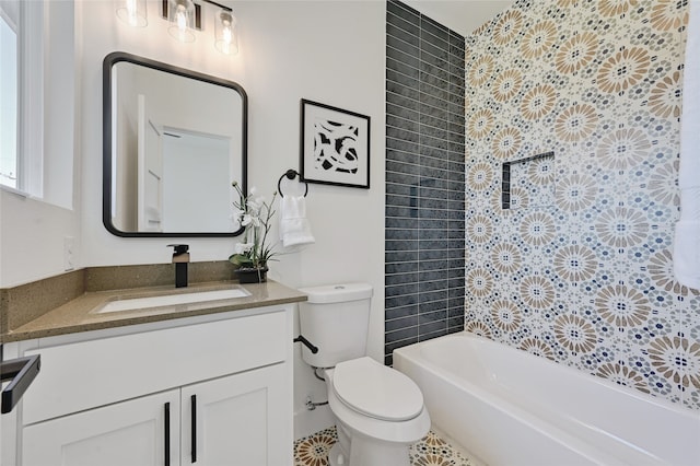 bathroom with tub / shower combination, vanity, and toilet