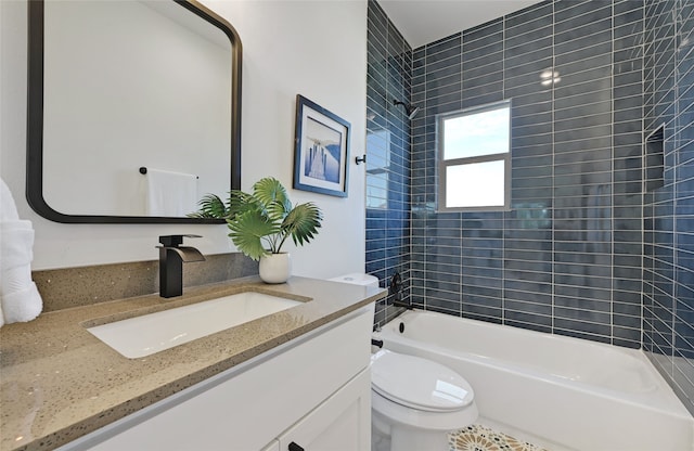 bathroom featuring toilet,  shower combination, and vanity