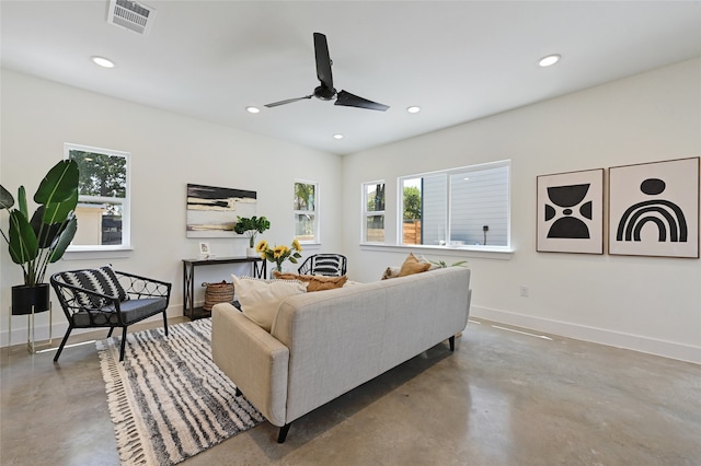 living area featuring recessed lighting, visible vents, a ceiling fan, concrete floors, and baseboards