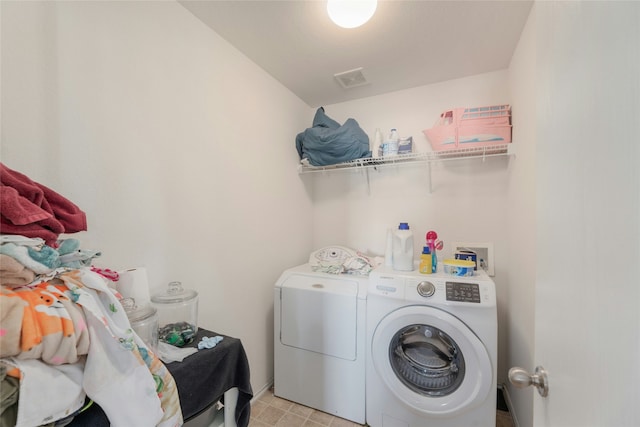 laundry area with washing machine and clothes dryer