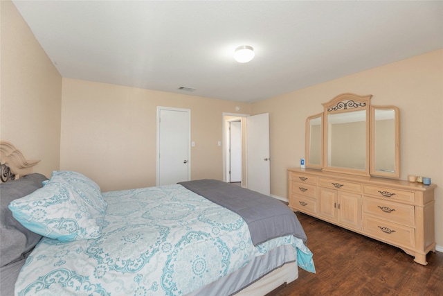 bedroom featuring dark hardwood / wood-style floors