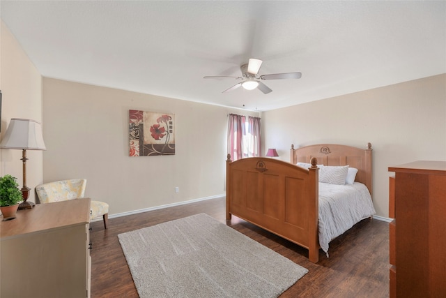 bedroom with ceiling fan and dark hardwood / wood-style floors