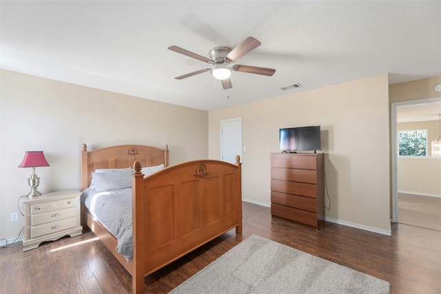 bedroom featuring dark wood-type flooring and ceiling fan