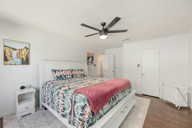 bedroom featuring dark wood-type flooring and ceiling fan