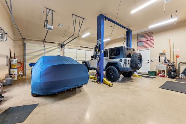 garage featuring a garage door opener and gas water heater