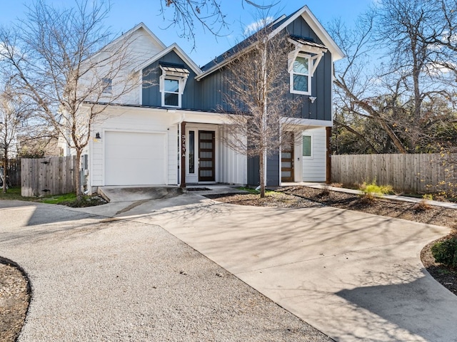 3711 Garden Villa Ln Unit A, Austin, TX 78704 - view of front of home with concrete driveway, board and batten siding, and an attached garage