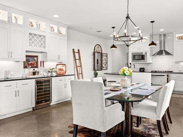3711 Garden Villa Ln Unit A, Austin, TX 78704 - dining room featuring wine cooler, finished concrete floors, bar area, recessed lighting, and a chandelier