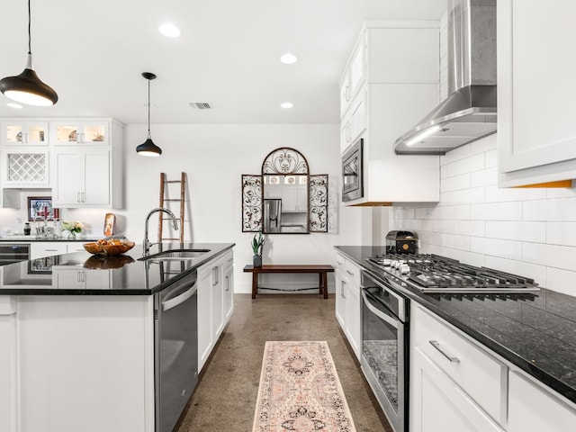3711 Garden Villa Ln Unit A, Austin, TX 78704 - kitchen featuring wall chimney exhaust hood, stainless steel appliances, decorative backsplash, white cabinets, and recessed lighting