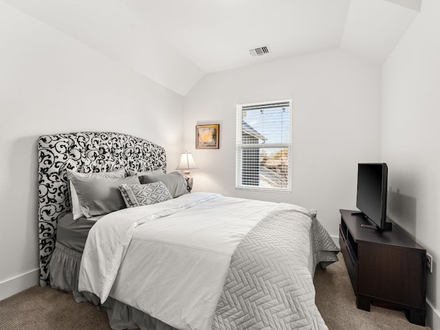3711 Garden Villa Ln Unit A, Austin, TX 78704 - carpeted bedroom with lofted ceiling and baseboards