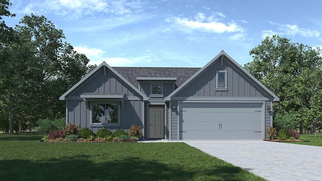 view of front of house with a garage and a front lawn