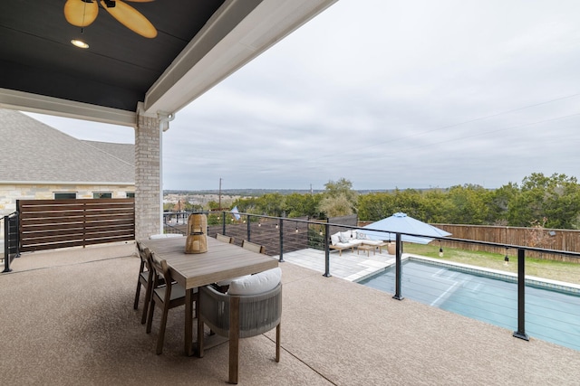 view of pool featuring a patio and ceiling fan