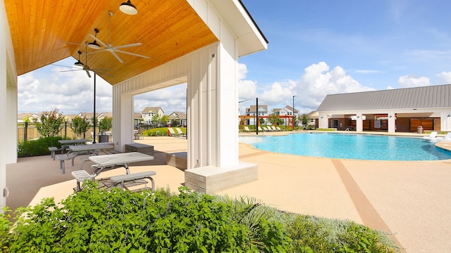 view of pool with ceiling fan and a patio area