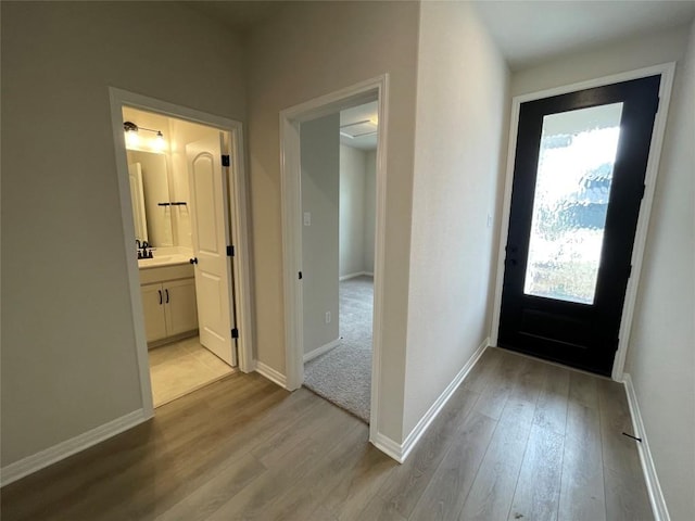 interior space featuring sink and light hardwood / wood-style floors