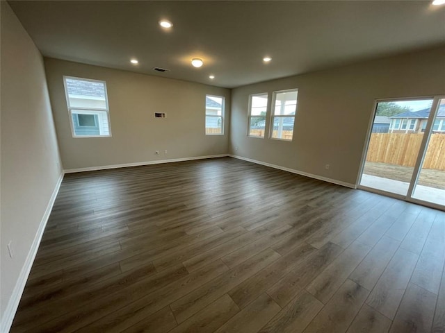 empty room featuring dark hardwood / wood-style flooring