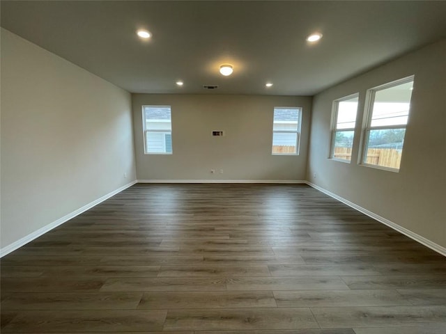 unfurnished room featuring dark hardwood / wood-style floors