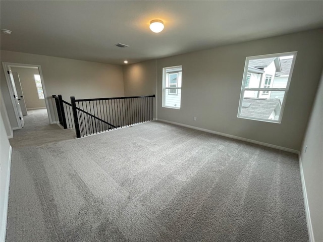 spare room with light carpet