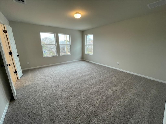 unfurnished room featuring carpet floors