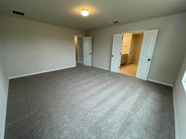 unfurnished bedroom with carpet