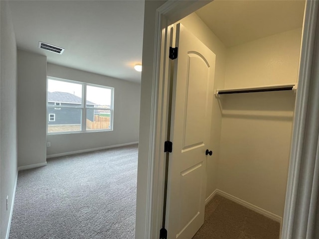 hallway featuring carpet