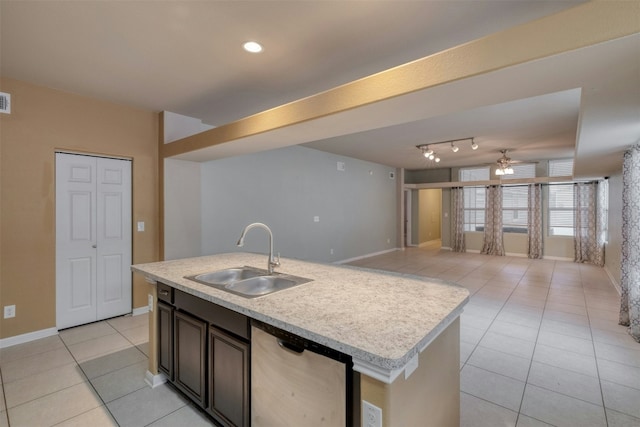 kitchen with rail lighting, sink, dishwasher, ceiling fan, and a kitchen island with sink