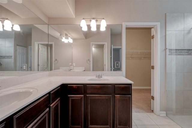 bathroom with tile patterned flooring and vanity