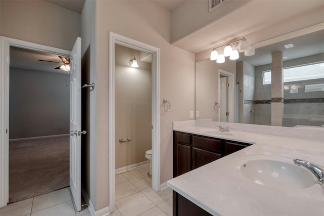 bathroom with vanity, toilet, and tile patterned flooring