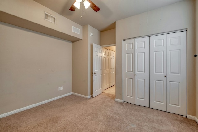 unfurnished bedroom with light carpet and ceiling fan