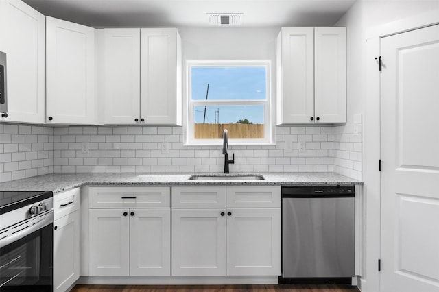 kitchen featuring white cabinetry, sink, and appliances with stainless steel finishes