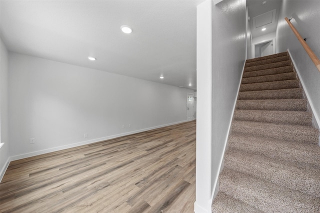 stairs with wood-type flooring