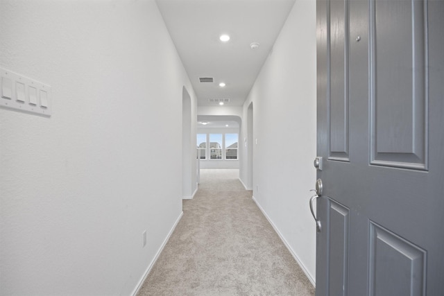 hallway with light carpet