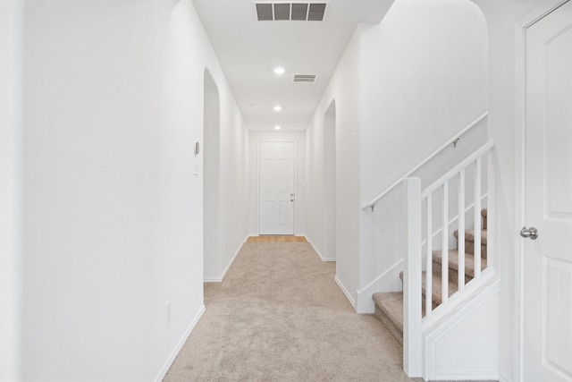 corridor with light carpet