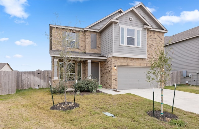 craftsman-style home with a garage and a front yard