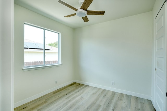 spare room with ceiling fan and light hardwood / wood-style flooring