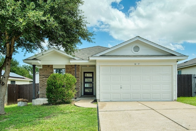 ranch-style home featuring a garage and a front lawn