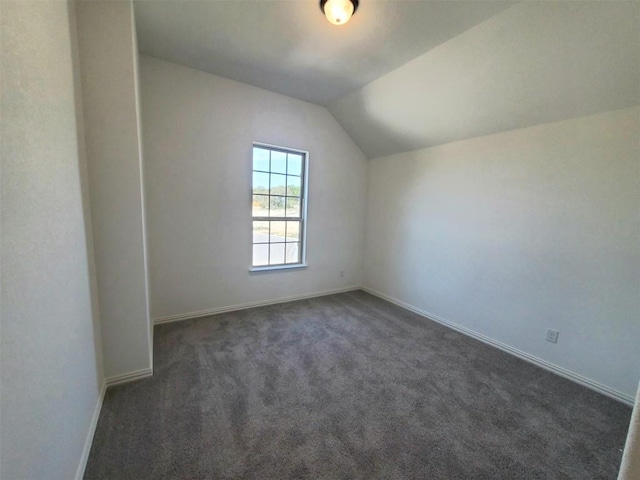 1501 Cole Estates Dr, Georgetown, TX 78628 - additional living space with vaulted ceiling, baseboards, and dark carpet