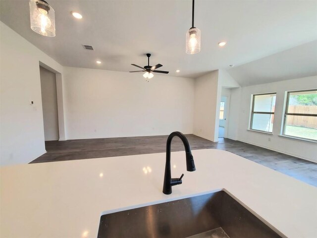 1501 Cole Estates Dr, Georgetown, TX 78628 - kitchen with open floor plan, a ceiling fan, wood finished floors, recessed lighting, and lofted ceiling