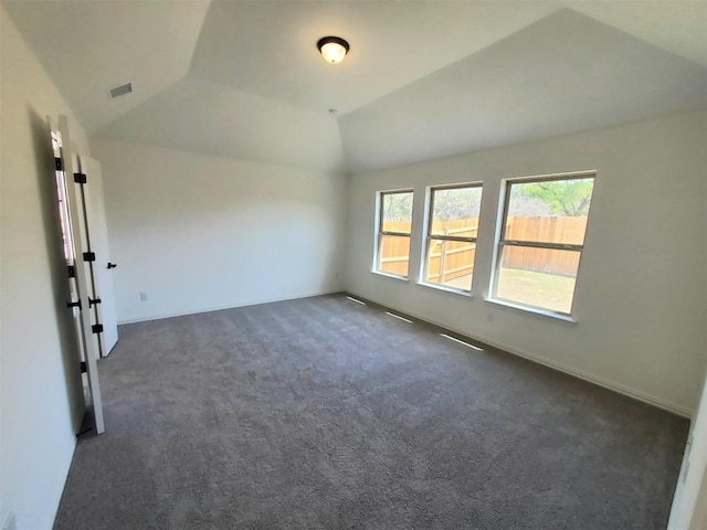 1501 Cole Estates Dr, Georgetown, TX 78628 - unfurnished room with vaulted ceiling, dark colored carpet, and baseboards