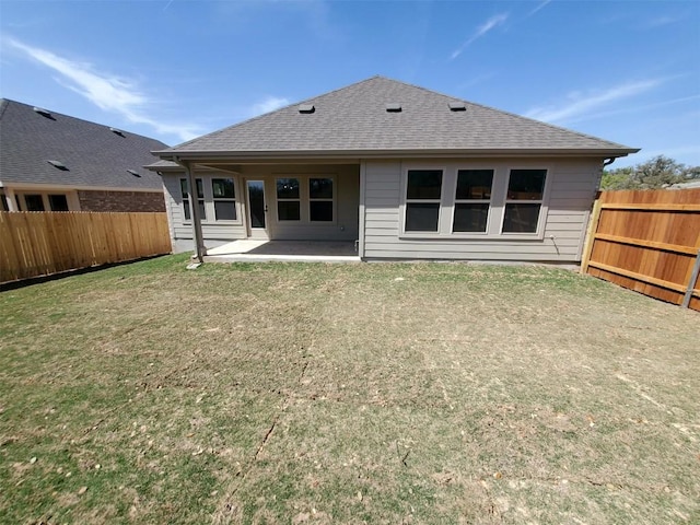 1501 Cole Estates Dr, Georgetown, TX 78628 - back of property featuring a fenced backyard, roof with shingles, and a patio area