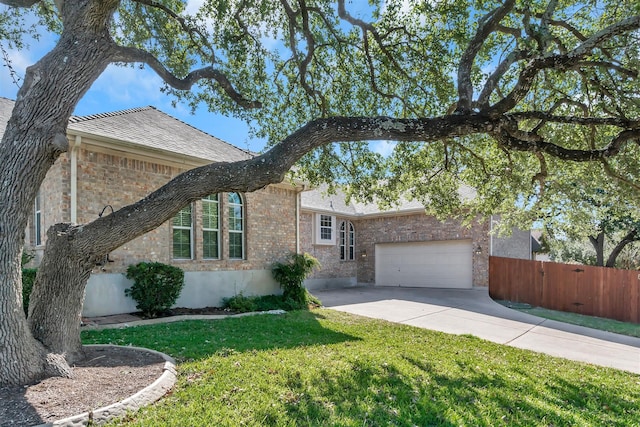 ranch-style house with a garage and a front yard