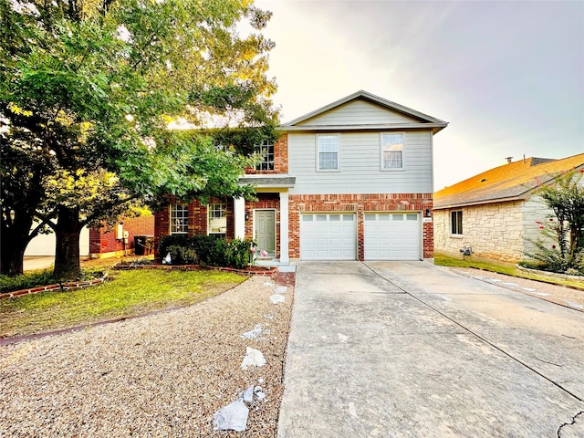 view of front property featuring a garage and a front lawn