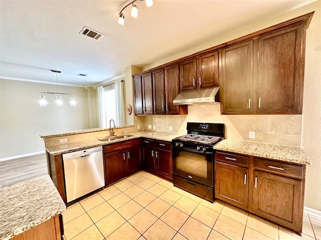 kitchen featuring black range with gas cooktop, sink, decorative light fixtures, stainless steel dishwasher, and kitchen peninsula