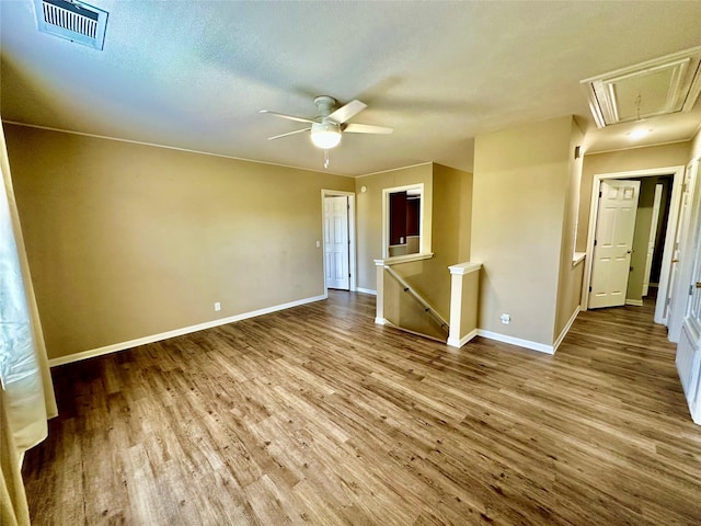 unfurnished room with hardwood / wood-style floors and ceiling fan