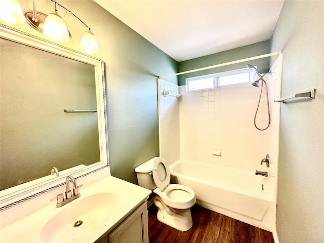 full bathroom featuring toilet, wood-type flooring, bathtub / shower combination, and vanity