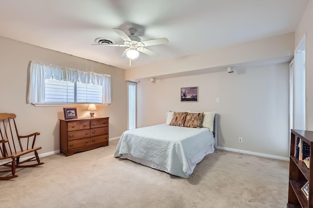 bedroom featuring ceiling fan and light carpet