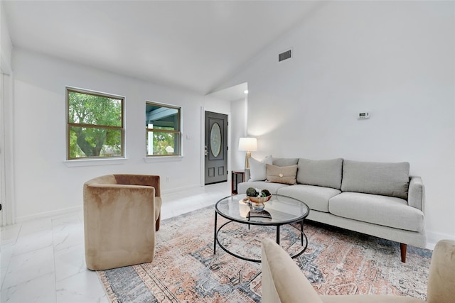 living area featuring marble finish floor, baseboards, visible vents, and high vaulted ceiling